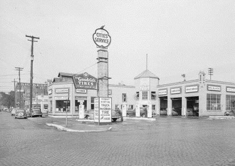 Historic Cities Service gas station in Kalamazoo during the early twentieth century, representing commercial development during the period when housing segregation policies were shaping the city.